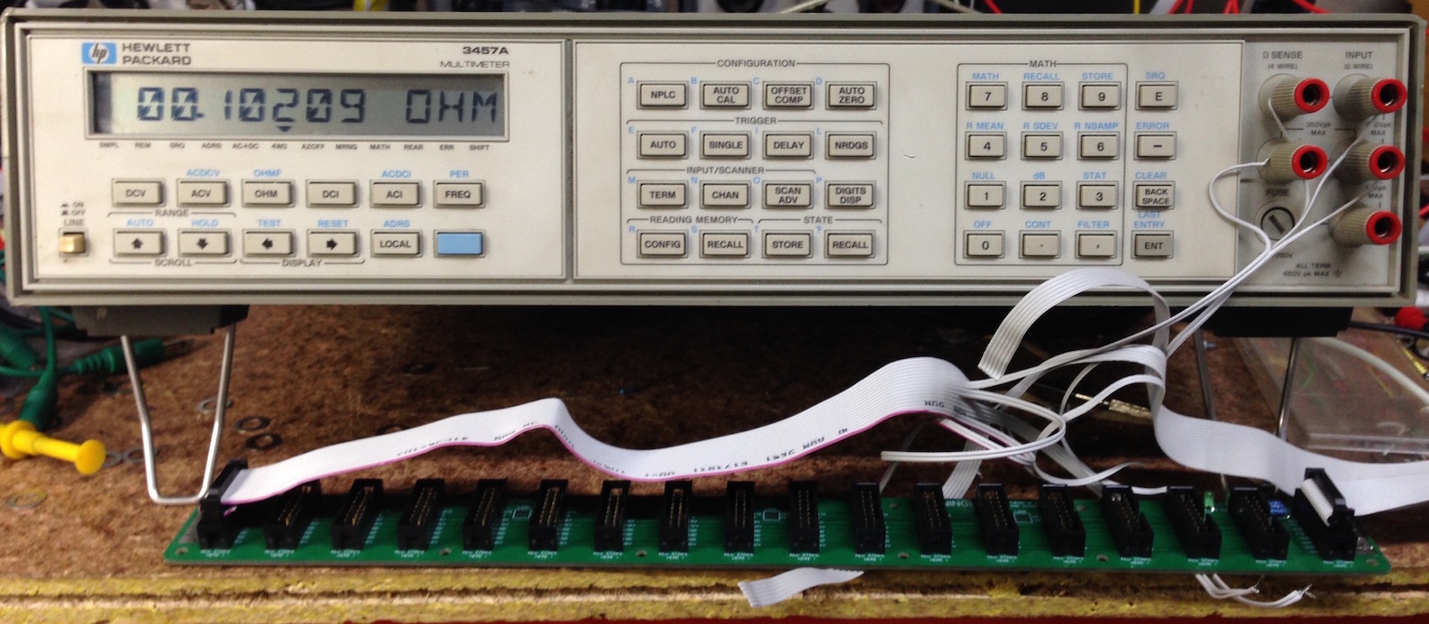 HP 3457a multimeter displaying 0.1 ohm trace resistance across a busboard